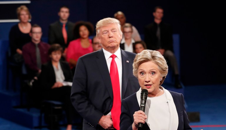 Hillary Clinton said her "skin crawled" when President Trump stood behind her as she answered questions during the second presidential debate last year, she reveals in her new book "What Happened." (Rick T. Wilking/Pool via AP)