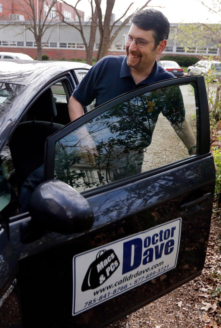 In this Monday, April 21, 2014 photo, Dave Greenbaum, who runs a computer repair business, gets into his vehicle outside his house in Lawrence, Kan. Despite increasing acceptance of gay lifestyles in the U.S., gay small business owners like Greenbaum say they still encounter discrimination from possible customers and investors. (AP Photo/Orlin Wagner)