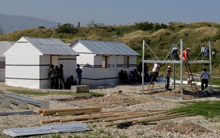 Red Cross workers build prototype homes in Port-au-Prince in Haiti. (AP Photo/Andres Leighton)