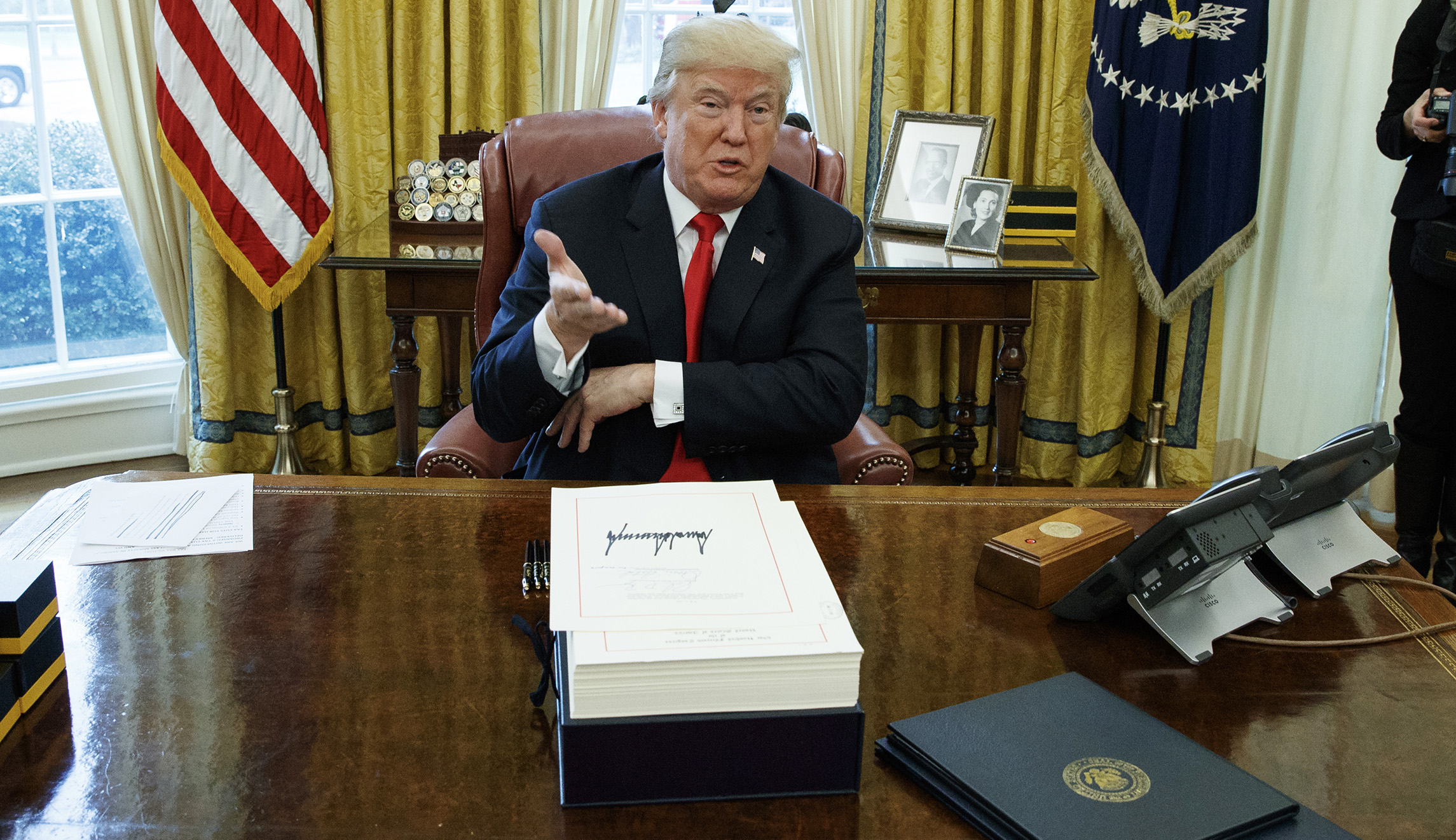 Trump declares Obamacare is ‘over’ as he signs individual mandate repeal into law
