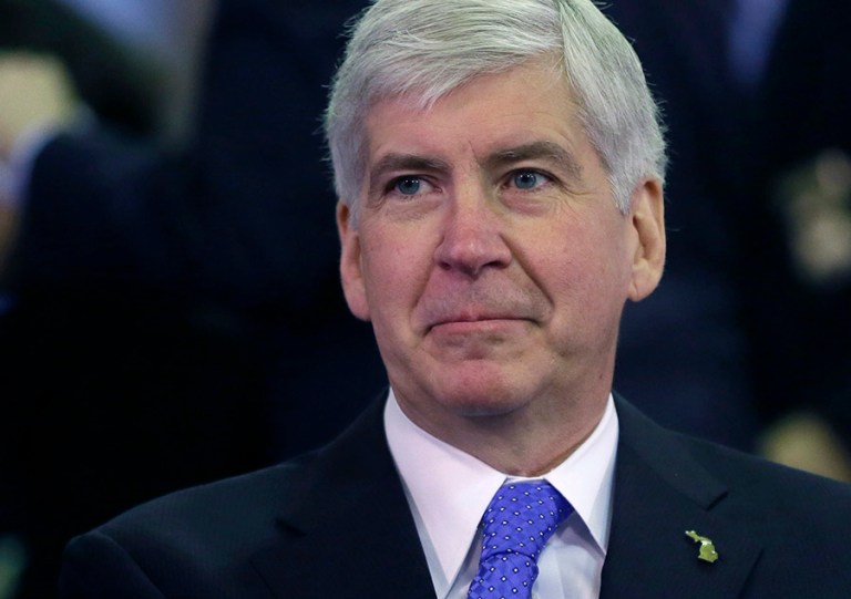 Snyder responded in a tweet, saying he was taking responsibility for switching the city's water source to the Flint River, whose excessively polluted water corroded lead pipes and contamined the public source. (AP Photo/Carlos Osorio, File)