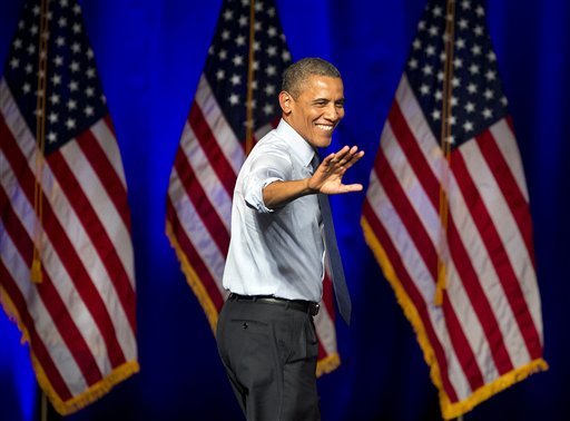 President Barack Obama waves to supporters at a fundraising event in Austin, Texas, Tuesday evening, July 17, 2012. (AP Photo/Austin American-Statesman, Ralph Barrera)