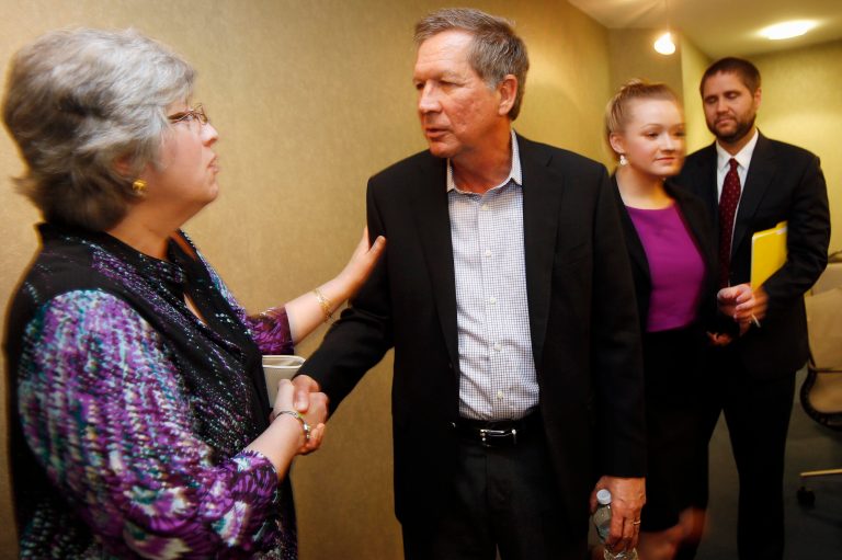 Ohio Gov. John Kasich, R-Ohio shakes hands after a luncheon with area business leaders, Thursday, June 4, 2015, in Portsmouth, N.H. Kasich is considering a rein for the Republican nomination for president. (AP Photo/Jim Cole)