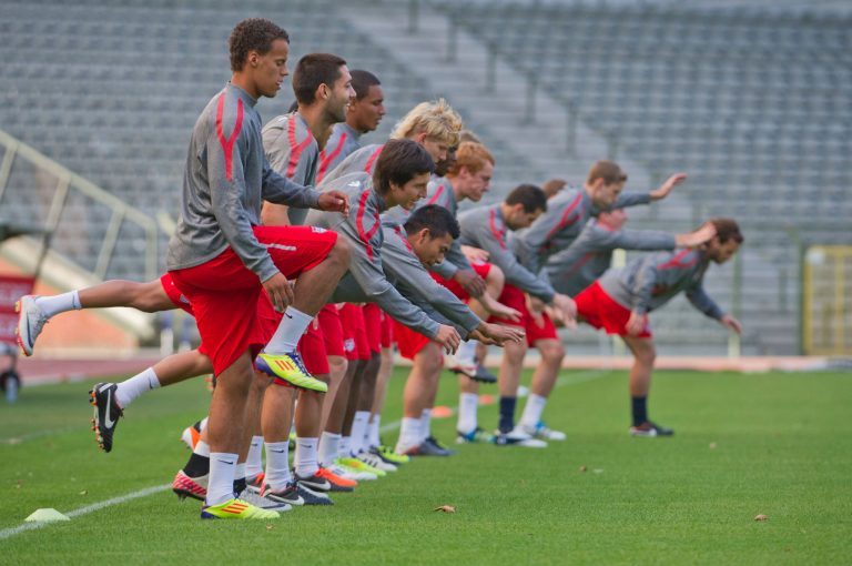 U.S. national soccer team players warm up during a training session in 2011. (AP Photo/Geert Vanden Wijngaert)