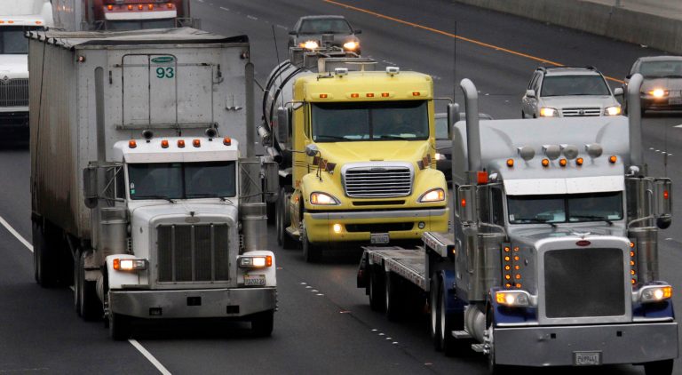   FILE - In this Dec. 17, 2010 file photo, trucks make their way on eastbound in Livermore, Calif. The World Health Organization's cancer agency has determined that diesel exhaust causes cancer. It's raised the status of diesel exhaust from 