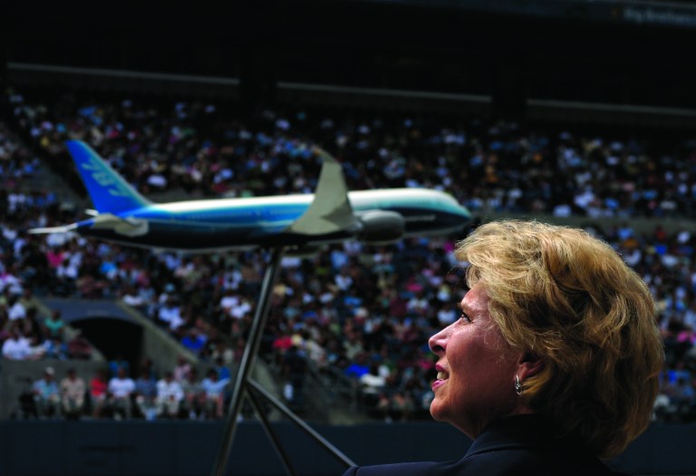 FILE - In this Sunday, July 8, 2007, file photo, Governor Chris Gregoire watches a presentation during a special live broadcast for Boeing employees and friends, at Qwest Field, in Seattle. The Boeing 787 was a plane that promised to be lighter and more technologically advanced than any other, but once production started, the gap between vision and reality quickly widened. The jet that was eventually dubbed the Dreamliner became plagued with manufacturing delays, cost overruns and sinking worker morale(AP Photo/Andrei Pungovschi, File)