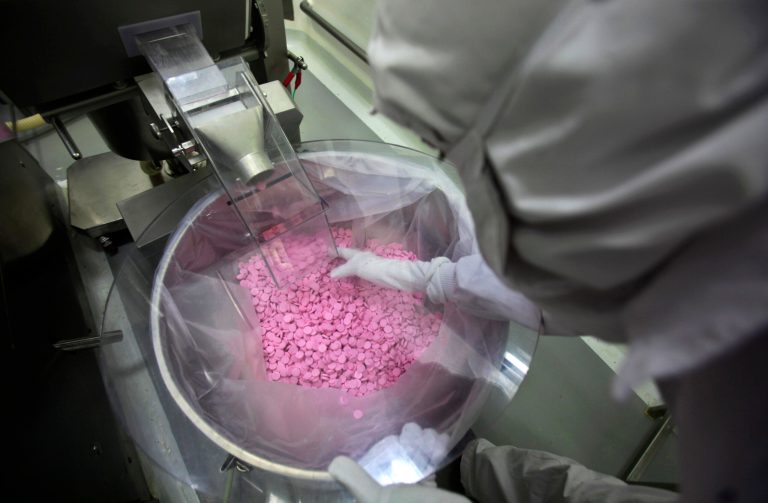 A chemist is seen working in a lab where medicines are being produced at a Cipla manufacturing unit on the outskirts of Mumbai, India. (AP File)