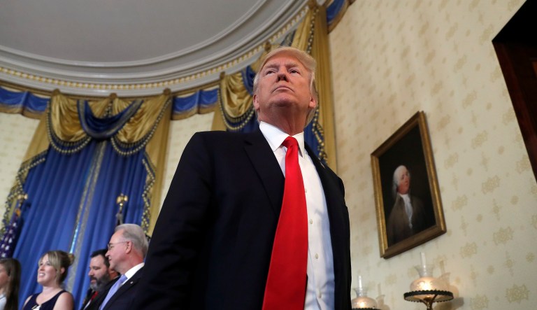 Trump told the New York Times in November that he didn't feel "very strongly" about following through on his campaign promise to investigate Clinton. But Trump appears to have changed his mind. (AP Photo/Alex Brandon)