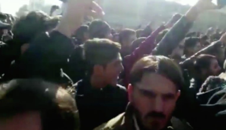Protesters in Iran have reportedly yelled slogans critical of Iranian President Hassan Rouhani and the country's powerful clerics. (screenshot)