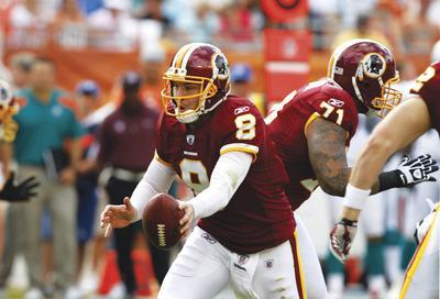 Hans Deryk/AP
Rex Grossman completed 21 of 32 passes for 215 yards and two interceptions during the Redskins'loss to Miami on Sunday.