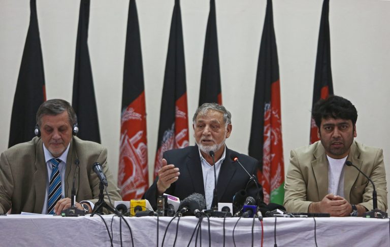 Ahmad Yousuf Nouristani, chairman of Afghanistan's Independent Election Commission (IEC), center, speaks during a joint press conference as Jan Kubis, United Nation representative for Afghanistan, left, and Abdul Satar Saadat, chief of Afghanistan's Electoral Complaints Commission, listen at the IEC office in Kabul, Afghanistan, Sunday, July 13, 2014. Welcoming an agreement between the two top candidates brokered by U.S. Secretary of State John Kerry and the United Nations, Afghanistan's election commission hopes to finish an audit of 23,000 polling stations within three weeks. (AP photo/Rahmat Gul)