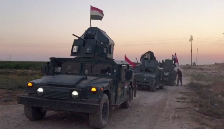 Iraqi state media say federal troops have entered disputed territories occupied by the nation's Kurds. The move comes three years after Kurdish militias seized the areas outside their autonomous region to defend against an advance by the Islamic State extremist group. (APTN via AP)