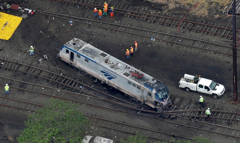 Emergency personnel work at the scene of a deadly train wreck, Wednesday, May 13, 2015, in Philadelphia. (AP Photo/Patrick Semansky)