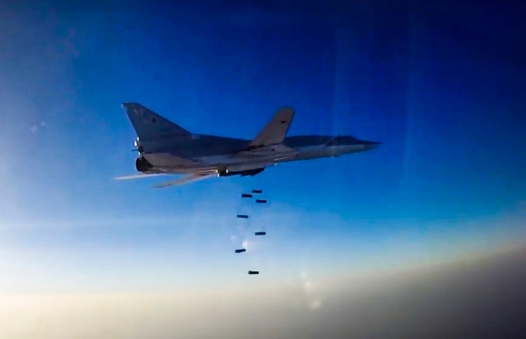 A Russian long-range bomber Tu-22M3 flies during an airstrike over the Aleppo region of Syria. It was reported last week that Russia was using an Iranian air base to launch attacks in Syria, a move that increased the complexity of the U.S. effort to fight the Islamic State in that country. (Russian Defence Ministry Press Service photo via AP, File)