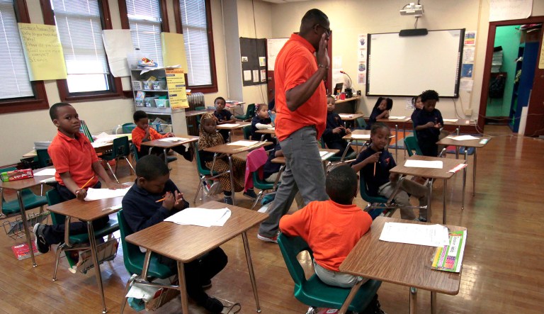 In this Oct. 20, 2017 photo, first-graders listen to teacher Dwane Davis at Milwaukee Math and Science Academy, a charter school in Milwaukee.