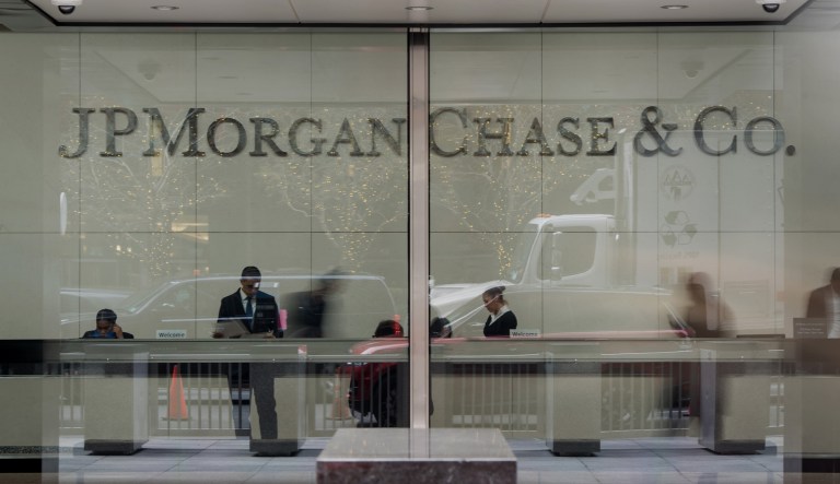 Employees work in the lobby of JPMorgan Chase & Co. headquarters in New York, U.S., on Monday, Dec. 8, 2014. U.S. stocks dropped, following the worst loss in six weeks for the Standard & Poor's 500 Index, as global shares slid on concern over growth in China and potential political turmoil in Greece.