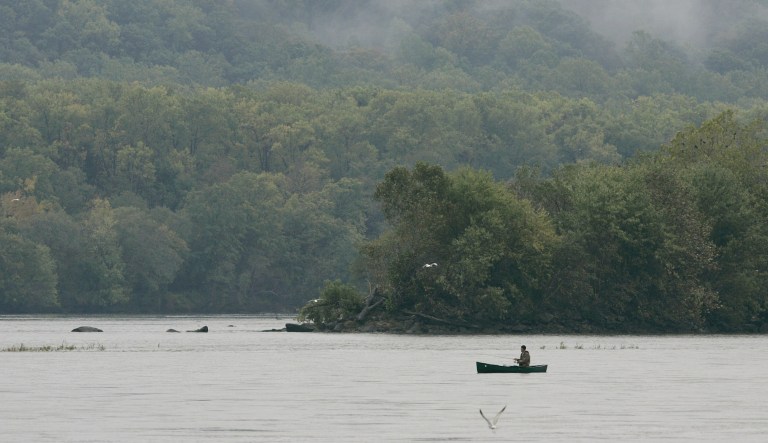 ** ADVANCE FOR SUNDAY, NOV 6 ** A lone fisherman fishes from his canoe in the middle of the Susquehanna River just south of the Conowingo Dam Saturday, Oct. 20, 2005 in Conowingo, Md. Every minute, on average, 18 million gallons of water rush down the lower Susquehanna River, carrying a polluted mixture of mud, manure, fertilizer, coal dust and toxic substances toward the Chesapeake Bay. For 77 years, the Conowingo Dam has acted as a final barrier against that onslaught, protecting the ecologically valuable Susquehanna Flats