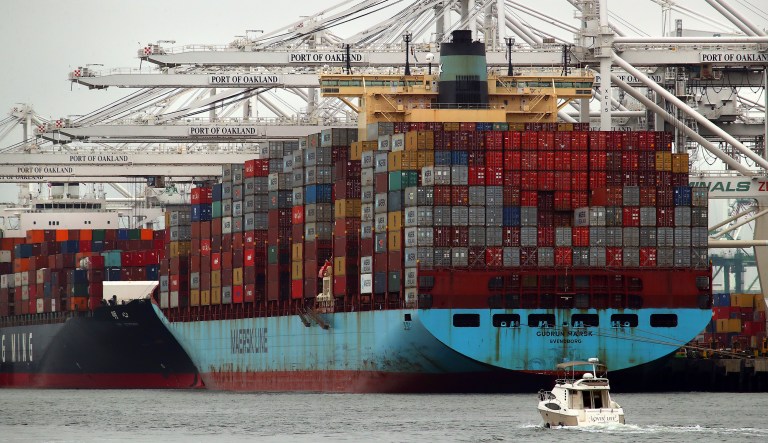 Container ships wait to be unloaded at the Port of Oakland on Monday, July 2, 2018, in Oakland, Calif. The Trump administration on Friday, July 6, 2018, will start imposing tariffs on $34 billion in Chinese imports.