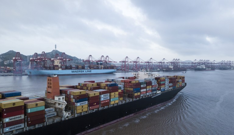 The Soro Enshi container ship, operated by A.P. Moller-Maersk A/S, sails from Yangshan Deep Water Port in this aerial photograph taken in Shanghai, China, on Tuesday, July 10, 2018. China told companies to boost imports of goods from soybeans to seafood and automobiles from countries other than the U.S. after trade tensions between the world's two biggest economies escalated into a tariff war last week.