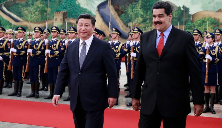 Venezuela's President Nicolas Maduro walks with Chinese President Xi Jinping during a ceremony at the Great Hall of the People in Beijing, Jan. 7, 2015.