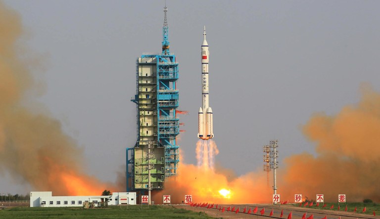 The Long March-2F carrier rocket carrying China's manned Shenzhou-9 spacecraft blasts off from the launch pad at the Jiuquan Satellite Launch Center in Jiuquan, northwest China's Gansu Province, June 16, 2012.