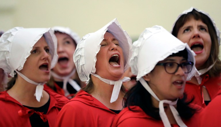 Activists dressed as characters from "The Handmaid's Tale" chant in the Texas Capitol Rotunda as they protest SB8, a bill that would require health care facilities, including hospitals and abortion clinics, to bury or cremate any fetal remains whether from abortion, miscarriage or stillbirth, and they would be banned from donating aborted fetal tissue to medical researchers, Tuesday, May 23, 2017, in Austin.
