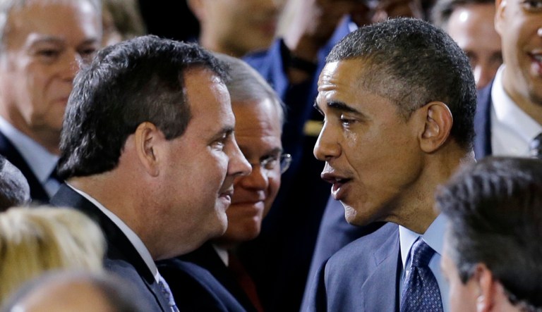 Sen. Robert Menendez, D-N.J., watches at center as President Barack Obama greets New Jersey Gov. Chris Christie after speaking to military members and families Monday, Dec. 15, 2014, at Joint Base McGuire-Dix-Lakehurst, in Wrightstown, N.J. Sen. Cory Booker, D-N.J. is at right.