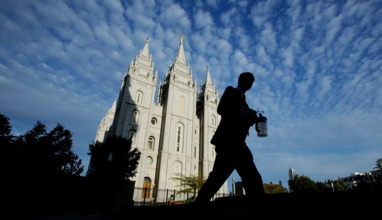 A man walks past the Salt Lake Temple,  a temple of The Church of Jesus Christ of Latter-day Saints, at Temple Square, Wednesday, Sept. 14, 2016, in Salt Lake City.