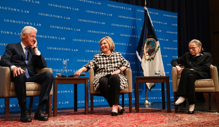 Former President Bill Clinton, left, former Secretary of State Hillary Clinton, and Supreme Court Justice Ruth Bader Ginsberg take their seats to speak, Wednesday, Oct. 30, 2019, at Georgetown Law's second annual Ruth Bader Ginsburg Lecture, in Washington.
