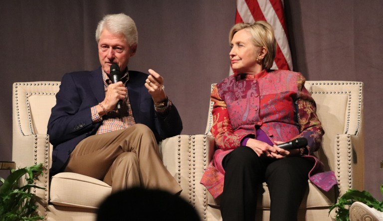 Accompanied by his wife, Hillary Clinton, former President Bill Clinton speaks at a gathering in Little Rock, Ark., on Saturday, Nov. 18, 2017, marking 25 years since his election.
