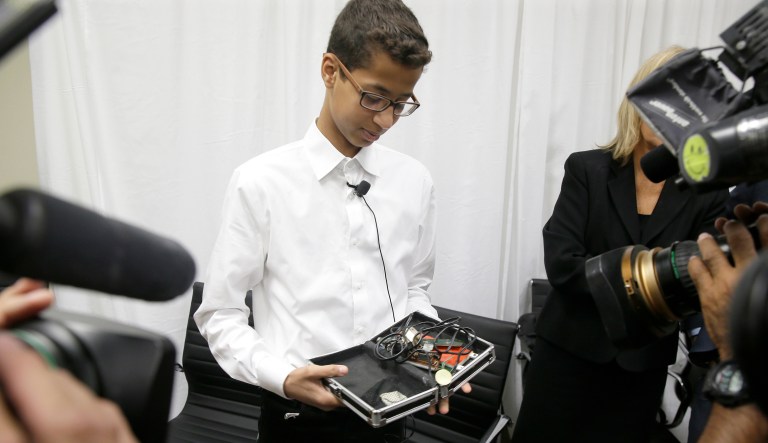 Ahmed Mohamed shows the clock he built in a school pencil box to reporters after a news conference in Dallas, Monday, Aug. 8, 2016. The family of Ahmed Mohamed, who was arrested after bringing the homemade clock to school, and charged with having a hoax bomb, filed a federal lawsuit against Texas school officials and others, saying they violated the 14-year-old boy's civil rights.