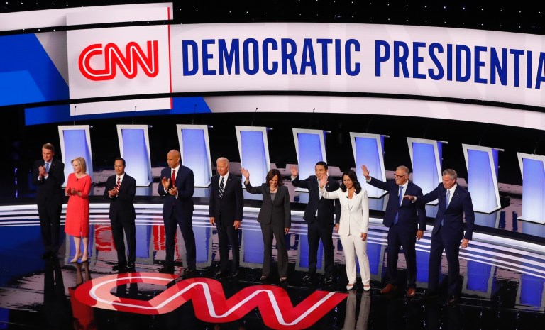 In this July 31, 2019 file photo, Sen. Michael Bennet, D-Colo., Sen. Kirsten Gillibrand, D-N.Y., former Housing and Urban Development Secretary Julian Castro, Sen. Cory Booker, D-N.J., former Vice President Joe Biden, Sen. Kamala Harris, D-Calif., Andrew Yang, Rep. Tulsi Gabbard, D-Hawaii, Washington Gov. Jay Inslee and New York City Mayor Bill de Blasio are introduced before the second of two Democratic presidential primary debates hosted by CNN in the Fox Theatre in Detroit.