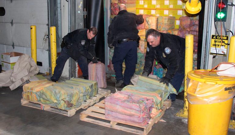 This Feb. 28, 2019, photo provided by U. S. Customs and Border Protection shows Customs agents unloading a truck containing 3,200 pounds of cocaine in 60 packages, where it was seized at the Port of New York and New Jersey in Newark, N.J.