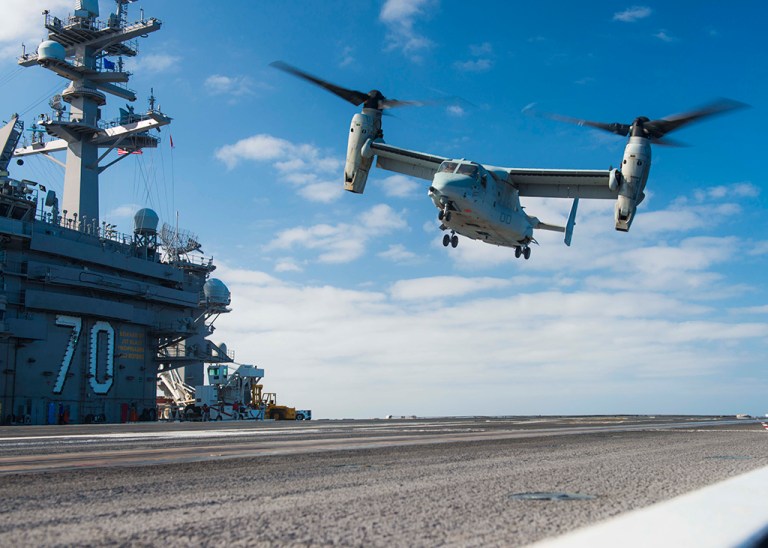 An MV-22B Osprey lands on the aircraft carrier USS Carl Vinson in 2016. The Osprey was being tested and evaluated as a replacement for the C-2 Greyhound at the time.
