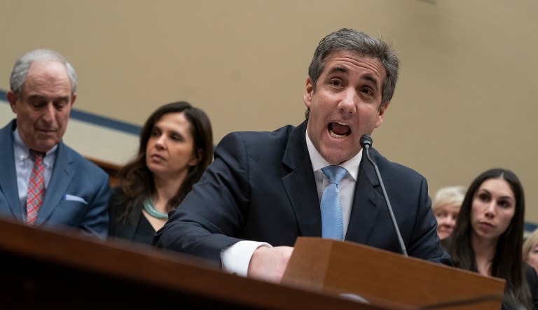 Michael Cohen, President Donald Trump's former personal lawyer, reads an opening statement as he testifies before the House Oversight and Reform Committee on Capitol Hill in Washington, Wednesday, Feb. 27, 2019.