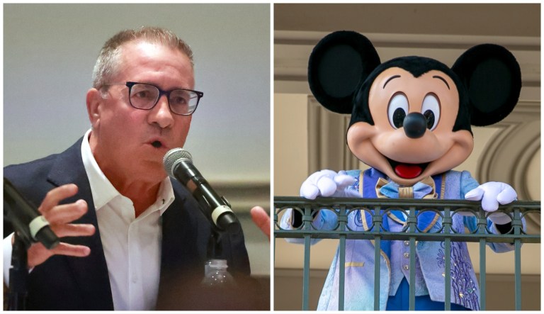 Central Florida Tourism Oversight District Chairman Martin Garcia and Mickey Mouse.