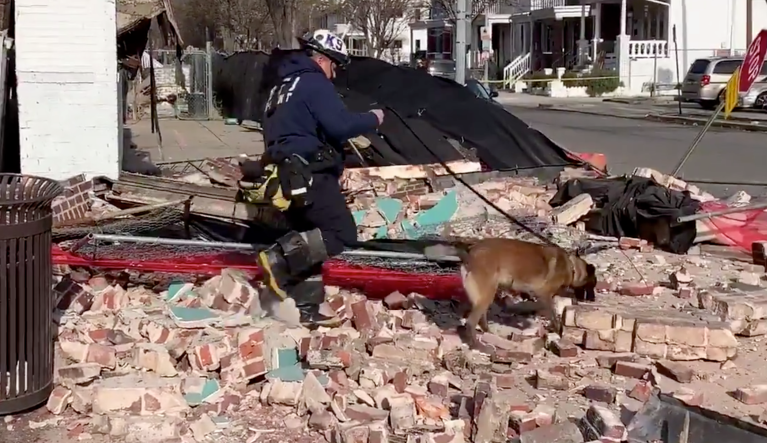 WATCH: Camera captures moment pedestrians narrowly avoid building collapse