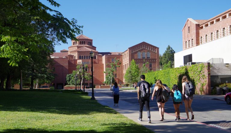 A group of students walking about on the UCLA campus.