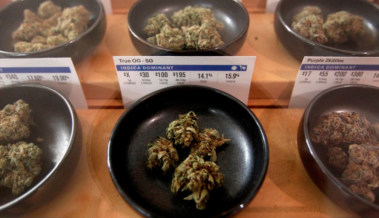 In this Jan. 1, 2018 file photo, various types of marijuana are on display at Harborside marijuana dispensary in Oakland, Calif.