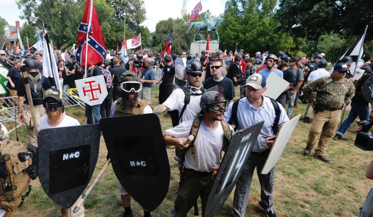 Alt Right demonstrators clash with  counter demonstrators at the entrance to Lee Park in Charlottesville, Va., Saturday, Aug. 12, 2017. 