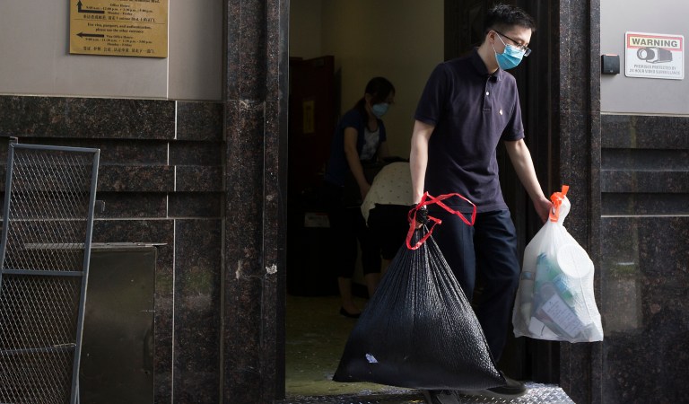 Consulate workers remove items from the Consulate General of China in Houston. 