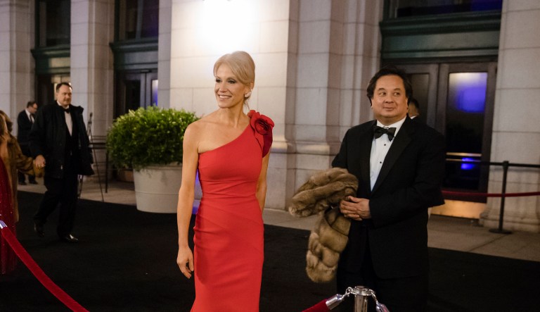 In this Thursday, Jan. 19, 2017 file photo, President-elect Donald Trump adviser Kellyanne Conway, center, accompanied by her husband, George, speaks with members of the media as they arrive for a dinner at Union Station in Washington, the day before Trump's inauguration.
