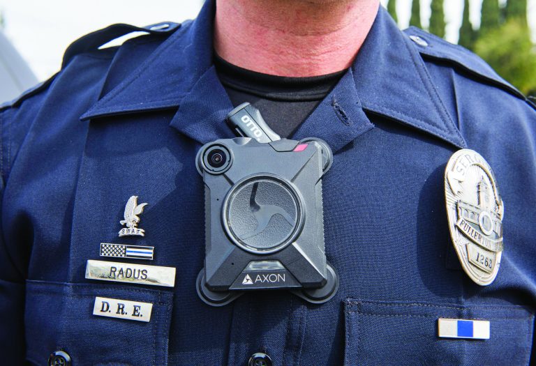 Fullerton Police Sgt. Jon Radus wears his body camera high on his chest attached with a magnetic device while on patrol in Fullerton, Calif.