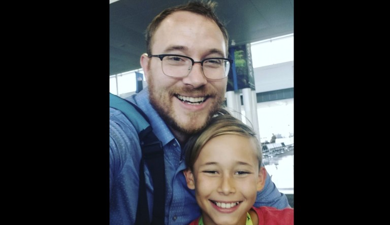 In this photo provided by T.J. Sjostrum and taken July 26, 2019, is Sjostrum with his son Nolan at the Dulles International Airport in Dulles, Virginia, after his son flew over for the summer. The coronavirus is wreaking havoc on divorced familiesâ custody arrangements as parents get sick or exposed to the illness. In other cases, it is driving already feuding exes to battle over how seriously the other is heeding stay-at-home orders. Sjostrum, a 36-year-old researcher in Virginia, said he was getting ready to pick up his 10-year-old son when his ex-wife said she wanted the boy to stay with her for the duration of the stay-at-home order. He said he had already been waiting for a court hearing to revisit their custody plan and now doesn't know when he'll get one. 