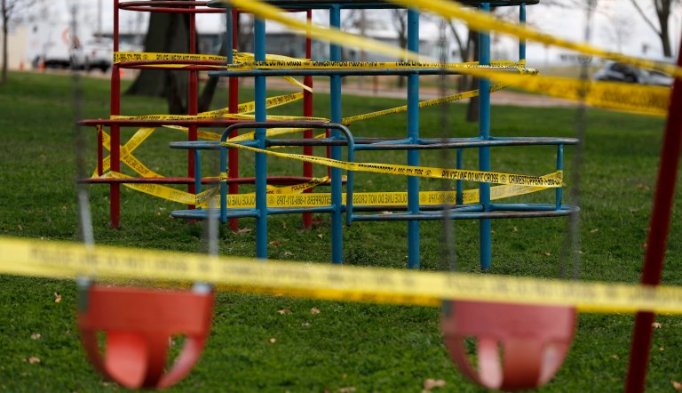 Playground equipment is wrapped in crime scene tape to prevent its use as part of the effort to slow the spread of the coronavirus Tuesday, March 31, 2020, in St. Louis. City officials are allowing the use of parks, provided proper social distancing guidelines are observed, but have closed areas such as playgrounds and basketball courts while a stay-at-home order is in effect.