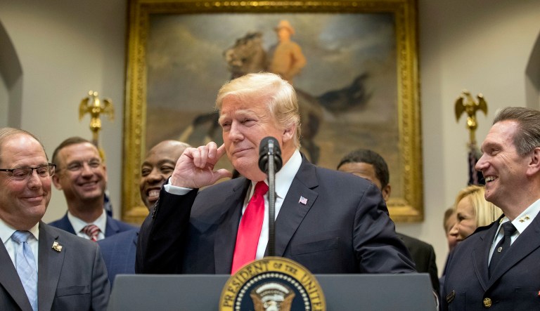 President Donald Trump points to his ear and says "Did I hear the word bipartisan?" as he announces his support for H. R. 5682, the "First Step Act" as bipartisan legislation during a speech in the Roosevelt Room of the White House in Washington, Wednesday, Nov. 14, 2018, which would reform America's prison system.