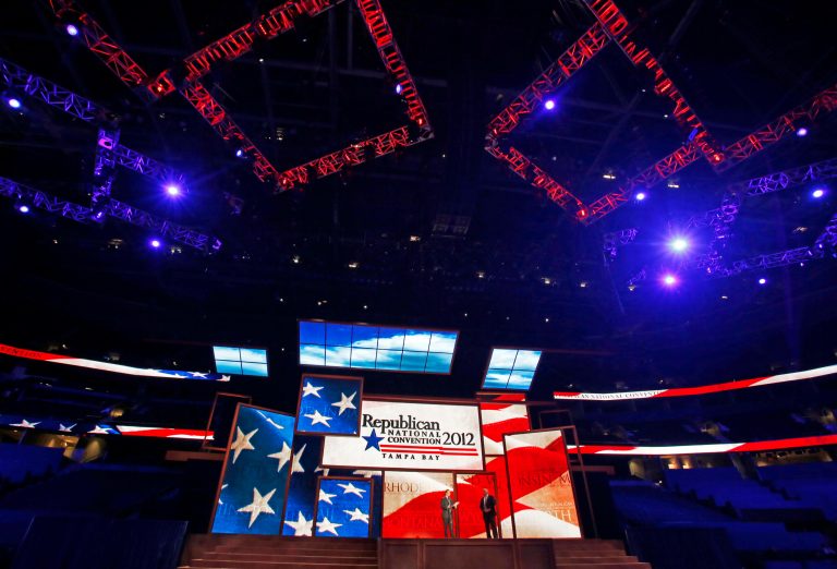 Republican National Committee Chairman Reince Priebus, left, and convention CEO William Harris unveil the stage and podium for the 2012 Republican National Convention, Monday, Aug. 20, 2012, at the Tampa Bay Times Forum in Tampa, Fla. (AP Photo/Scott Iskowitz)