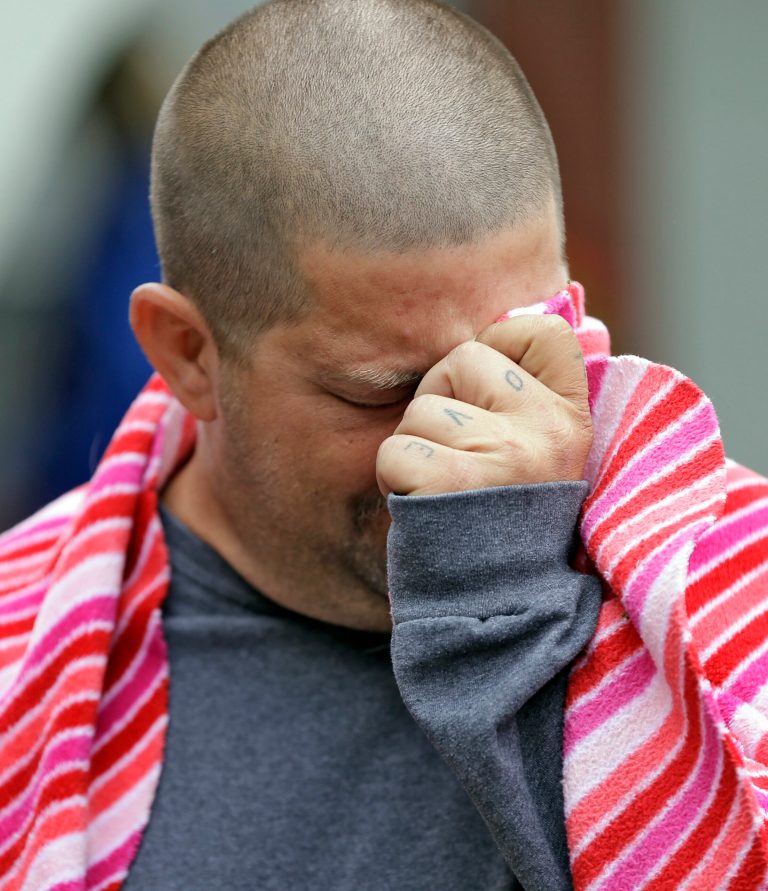 Jeremy Bush, brother of Jeff Bush, breaks down as he speaks to the media about attempting to rescue Jeff as he disappeared in a sinkhole Friday, March 1, 2013, in Seffner, Fla. Jeff Bush screamed for help and disappeared as a large sinkhole opened under the bedroom of the house, his brother said Friday. Jeremy Bush told rescue crews he heard a loud crash near midnight Thursday, then heard his brother screaming. There's been no contact with Jeff Bush since then, and neighbors on both sides of the home have been evacuated. (AP Photo/Chris O'Meara)