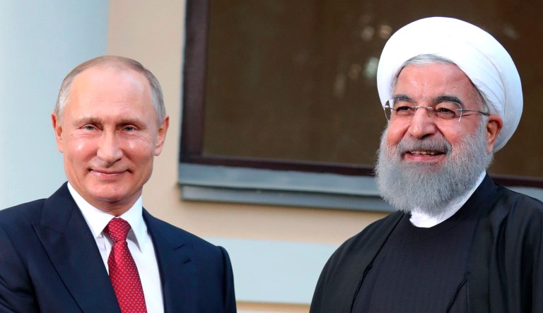 Russian President Vladimir Putin, left, and President of Iran Hassan Rouhani, right. Following a Russian veto, the United Nations adopted a toothless resolution drafted by Russia merely renewing the previous arms embargo and piously expressing "grave distress" at the "continued deterioration of the devastating humanitarian situation in Yemen." (Mikhail Klimentyev, Kremlin Pool Photo via AP)
