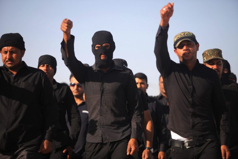 Volunteers train at military base in the Shiite holy city of Najaf, 100 miles south of Baghdad, Iraq, June 17. (AP/ Jaber al-Helo)